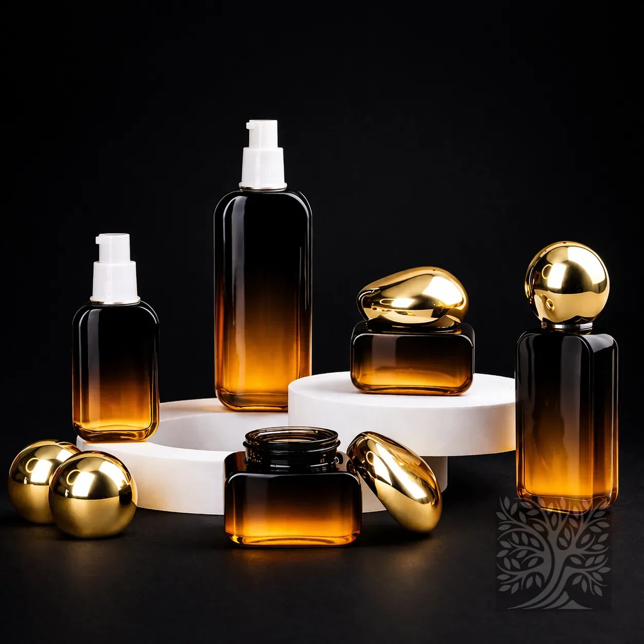 Amber gradient glass skincare bottles and jars with gold accents, arranged in a warm-toned coordinated product set.