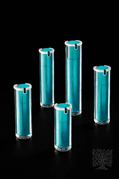 Teal acrylic skincare bottles with silver caps and transparent outer walls, presented as a cohesive Elevé packaging set.