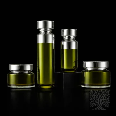 Olive green acrylic serum bottles and jars with chrome silver lids, styled in a clean and balanced skincare packaging layout.