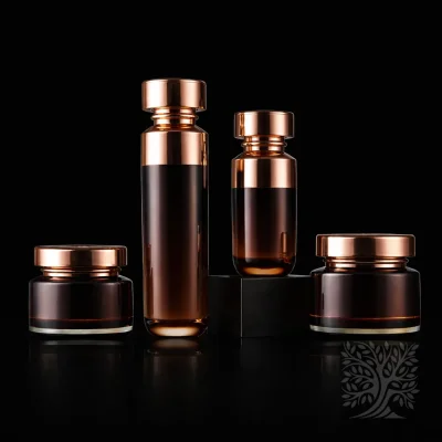Amber acrylic skincare bottles and cosmetic jars with polished gold caps, featuring tall cylindrical forms and wide cream jars.